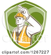 Retro Male Construction Builder Foreman Pointing In A Green And White Shield