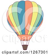 Clipart Of A Blue Orange Yellow And Green Hot Air Balloon Royalty Free Vector Illustration