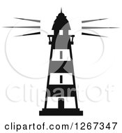 Clipart Of A Black And White Lighthouse Shining Royalty Free Vector Illustration