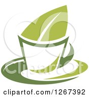 Clipart Of A Two Toned Steamy Hot Green Tea Cup And Leaf Royalty Free Vector Illustration