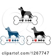 Clipart Of Silhouetted Canines Over Bones With I Love Dog Text And A Heart Shaped Paw Prints Royalty Free Vector Illustration