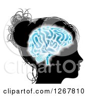 Poster, Art Print Of Silhouetted Womans Head With A Glowing Blue Brain