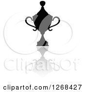 Clipart Of A Black Silhouetted Trophy Or Urn And Reflection Royalty Free Vector Illustration