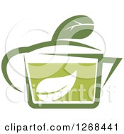 Clipart Of A Pot Of Green Tea With A Leaf 4 Royalty Free Vector Illustration