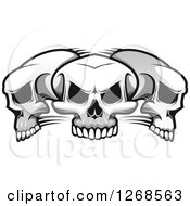 Clipart Of A Grayscale Trio Of Evil Human Skulls Royalty Free Vector Illustration