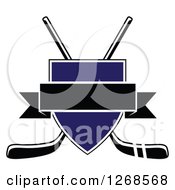 Poster, Art Print Of Crossed Black And White Hockey Sticks Behind A Blue Shield With A Blank Black Banner