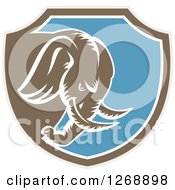 Poster, Art Print Of Retro Woodcut Charging Elephant In A Taupe Brown White And Blue Shield