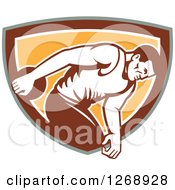 Poster, Art Print Of Retro Male Discus Thrower In An Orange Brown White And Green Shield