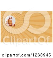 Clipart Of A Retro Fireman Holding An Axe Over An Orange Ray Business Card Design 2 Royalty Free Illustration