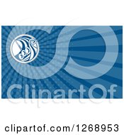 Clipart Of A Retro Viking Ship On Blue Rays Business Card Design Royalty Free Illustration by patrimonio