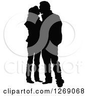Poster, Art Print Of Black Silhouette Of A Couple Standing And Kissing