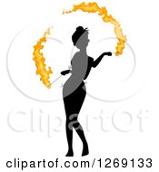 Clipart Of A Silhouetted Black Woman Fire Dancing With Colored Flames Royalty Free Vector Illustration