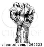 Clipart Of A Retro Black And White Engraved Propaganda Fist Royalty Free Vector Illustration