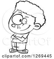 Clipart Of A Black And White Cartoon Confident Little Boy With Folded Arms Royalty Free Vector Line Art Illustration