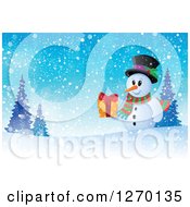 Poster, Art Print Of Snowman Holding A Gift On A Snowy Winter Hill