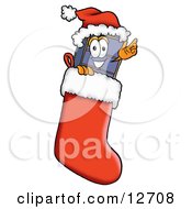 Clipart Picture Of A Suitcase Cartoon Character Wearing A Santa Hat Inside A Red Christmas Stocking by Toons4Biz