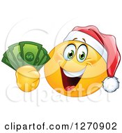Happy Emoticon Smiley Wearing A Christmas Santa Hat And Holding Cash Money