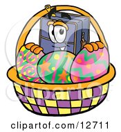 Suitcase Cartoon Character In An Easter Basket Full Of Decorated Easter Eggs