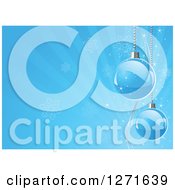 Clipart Of A Blue Christmas Background With Suspended Baubles Over Snowflakes And Rays Royalty Free Vector Illustration by Pushkin