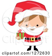 Poster, Art Print Of Caucasian Christmas Boy Wearing A Santa Suit And Holding A Gift