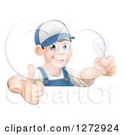 Poster, Art Print Of Happy Brunette White Male Electrician Giving A Thumb Up And Holding A Light Bulb Over A Sign