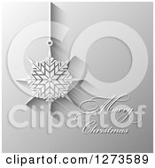 Clipart Of A Merry Christmas Greeting And Suspended Snowflake Ornament On Gray Royalty Free Vector Illustration