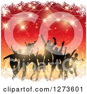 Poster, Art Print Of Silhouetted Group Of People Dancing At A Christmas Party Over Gradient Red And Orange With Snow And Flares