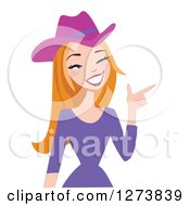 Clipart Of A Red Haired Caucasian Cowgirl Winking And Pointing Royalty Free Vector Illustration by peachidesigns
