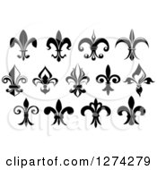 Clipart Of Black And White Lily Fleur De Lis Designs Royalty Free Vector Illustration