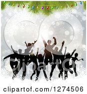 Poster, Art Print Of Silhouetted Crowd Of People Dancing And Jumping Under A Christmas Tree And Lights Over Silver Bokeh And Snowflakes