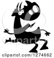 Clipart Of A Black And White Silhouetted Triceratops Dinosaur Sitting And Waving Royalty Free Vector Illustration by Cory Thoman