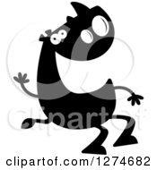 Clipart Of A Black And White Silhouetted Rhinoceros Sitting And Waving Royalty Free Vector Illustration by Cory Thoman