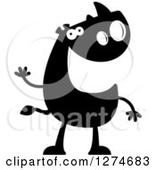 Clipart Of A Black And White Silhouetted Rhinoceros Waving Royalty Free Vector Illustration by Cory Thoman