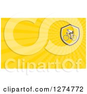 Clipart Of A Retro Cyclist And Yellow Rays Business Card Design Royalty Free Illustration