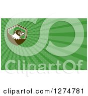 Clipart Of A Retro Falcon And Green Rays Business Card Design Royalty Free Illustration