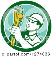 Clipart Of A Retro Male Plumber Holding A Monkey Wrench In A Green White And Turquoise Circle Royalty Free Vector Illustration