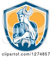 Clipart Of A Retro Woodcut Mechanic Man Holding A Giant Spanner Wrench In A Gray Blue White And Yellow Shield Royalty Free Vector Illustration