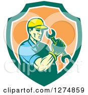 Poster, Art Print Of Retro Mechanic Man Holding A Spanner Wrench In A Green White And Orange Shield