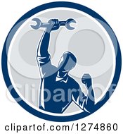 Poster, Art Print Of Retro Mechanic Man Pumping His Fist And A Spanner Wrench In A Blue White And Gray Circle