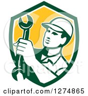 Poster, Art Print Of Retro Mechanic Man Holding A Spanner Wrench In A Green White And Yellow Shield