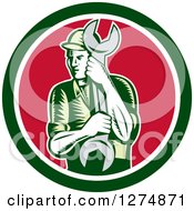 Clipart Of A Retro Woodcut Mechanic Man Holding A Giant Spanner Wrench In A Green White And Red Circle Royalty Free Vector Illustration