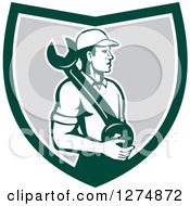 Clipart Of A Retro Mechanic Man Holding A Giant Spanner Wrench In A Green White And Gray Shield Royalty Free Vector Illustration