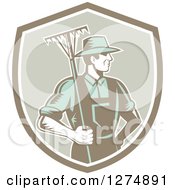 Poster, Art Print Of Retro Woodcut Male Gardener Or Farmer Holding A Rake In A Shield