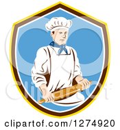 Retro Male Chef Holding A Rolling Pin In A Yellow Brown White And Blue Shield