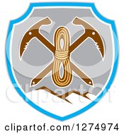 Clipart Of A Retro Rope Over Crossed Pickaxes In A Gray Blue And White Shield Of Mountains Royalty Free Vector Illustration