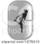 Poster, Art Print Of Black Silhouetted Female Fitness Competitor Bending Over On A Silver Pill