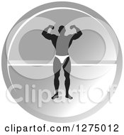 Poster, Art Print Of Black Silhouetted Male Bodybuilder Flexing Over A Round Silver Pill