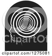 Clipart Of A Silhouetted Black Head In Profile Icon With A Spiral Royalty Free Vector Illustration by Lal Perera