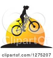Poster, Art Print Of Black Silhouetted Female Mountain Biker Jumping At Sunset