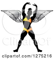 Clipart Of A Silhouetted Stretching Female Bodybuilder With Wings In A Yellow Suit Royalty Free Vector Illustration